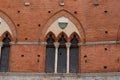 Architectural detail of the Palazzo Pubblico at the Piazza del Campo in Siena, Italy, Europe Royalty Free Stock Photo