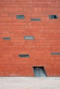 Architectural detail of red facade with windows, building exterior pattern Royalty Free Stock Photo