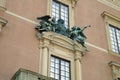 Architectural detail, sculptures adorned window of the Royal Palace, Stockholm, Sweden