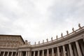 Architectural detail of statues standing on columns of saint peters basilica colonnade Royalty Free Stock Photo