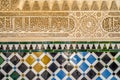 Architectural detail of tiles and Arabic ornaments in Alhambra palace complex, Granada, Spain