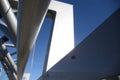 Architectural detail of white bridge on blue sky and bolts in foreground Royalty Free Stock Photo