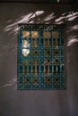 Architectural detail of a window with an oriental fence at sunset in Majorelle garden, Marrakech, Morocco Royalty Free Stock Photo