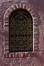 Architectural detail of a window with an oriental fence at sunset in Majorelle garden, Marrakech, Morocco Royalty Free Stock Photo