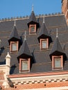 Architectural detail of windows in tiled roof of building near Grand Place, in the centre of Brussels, Belgium Royalty Free Stock Photo