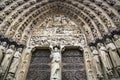 Architectural details of the arch above the main entrance of the Notre Dame de Paris