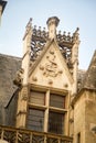 Architectural details and emblems of faculties on the roof of the Musee de Cluny a landmark national museum of medieval arts and