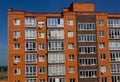 Architectural details of modern high apartment building facade with many windows and balconies Royalty Free Stock Photo