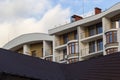 Architectural details of modern high apartment building facade with many windows and balconies Royalty Free Stock Photo