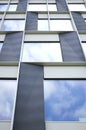 Architectural details of modern office building with reflections. Royalty Free Stock Photo