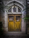 Architectural details - old wooden door with stained glass, entrance to the building with lanterns Royalty Free Stock Photo