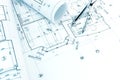 architectural drawing with rolls of blueprints and drawing compass Royalty Free Stock Photo