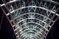 Architectural element of bridge dark night sky background. Steel glass construction illuminated many lights