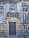 Architectural ensemble. ancient building with human sculptures on facade