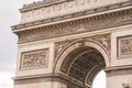 Architectural fragment of Arc de Triomphe. Arc de Triomphe de l\'Etoile on Charles de Gaulle Place is one of the most famous