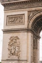 Architectural fragment of Arc de Triomphe. Arc de Triomphe de l\'Etoile on Charles de Gaulle Place is one of the most famous