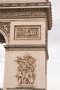 Architectural fragment of Arc de Triomphe. Arc de Triomphe de l\'Etoile on Charles de Gaulle Place is one of the most famous Royalty Free Stock Photo