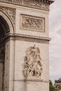 Architectural fragment of Arc de Triomphe. Arc de Triomphe de l\'Etoile on Charles de Gaulle Place is one of the most famous Royalty Free Stock Photo