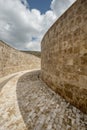 Architectural hallway with brick marble floor, curved walls with brown marble Royalty Free Stock Photo