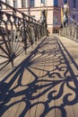 The architectural historical monument of the Hanging Bank Bridge with lions on the Griboyedov Canal in St. Petersburg on a sunny