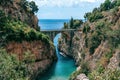 Architectural landmark, stone bridge. A view of the Fiordo of Furore in Amalfi coast, Travel and vacation concept. Summer day.