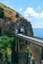 Architectural landmark, stone bridge. A view of the Fiordo of Furore in Amalfi coast, Travel and vacation concept. Summer day.