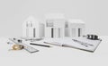 Architectural model of houses on desk with technical drawing tools, isolated on white background, desk top for building Royalty Free Stock Photo