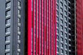 Architectural pattern from the windows and Ventilated facade of a multi-storey building. Symbol of urban life. Architectural Royalty Free Stock Photo