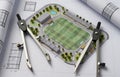 Architectural Plan for a Modern Sports Complex with Soccer Field and Drafting Compasses Royalty Free Stock Photo