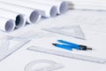Architectural plan project drawing with blueprints rolls. Royalty Free Stock Photo