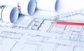 Architectural plans, pencils and roll. Technical project drawing Royalty Free Stock Photo