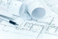 Architectural project plans, blueprint rolls, pencil and ruler o Royalty Free Stock Photo