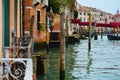 Architectural romantic view and decaying poles in Venice, Italy Royalty Free Stock Photo