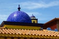 Architectural rooftops in Playa Las Americas in Teneriffe featuring tiled mosaic domes and terracotta tiles in retro Moorish style