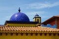 Architectural rooftops in Playa Las Americas in Teneriffe featuring tiled mosaic domes and terracotta tiles in retro Moorish style
