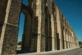 Architectural structure of aqueduct with arches and rectangular pillars Royalty Free Stock Photo