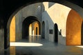 Architectural Sunlight and Shadow Play in an Arched Corridor Generative AI Royalty Free Stock Photo
