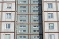 Architectural texture - multi-storey concrete panel apartment building lined with white tiles