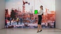 Architectural Vision: Professional Woman with Holographic Building Projection