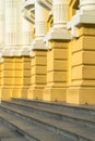 Architectural yellow columns of old building Royalty Free Stock Photo