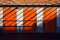 Architecture abstract background, three orange doors and shadows