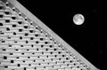 Architecture abstract photo with full moon in dark background.Fragment photo of Valletta New Parliament, Malta. Modern architectur