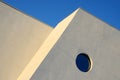 Architecture abstract wall with round window on blue sky Royalty Free Stock Photo