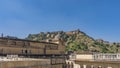 The architecture of Amber Fort. Sandstone walls, towers with domes, arches, columns