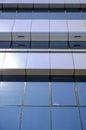 Architecture background fragment of a modern office building against blue sky Royalty Free Stock Photo