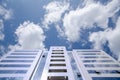 Architecture background fragment of a modern office building against blue sky with clouds Royalty Free Stock Photo