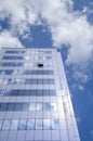 Architecture background, fragment of a modern office building against blue sky Royalty Free Stock Photo