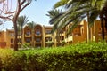 Architecture of buildings is in Arabic style. An arch windows in wall of arabic building. Picturesque courtyard of hotel