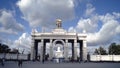 Architecture of Central entrance with colonnade to Park. Action. Tourists walking at architectural Central entrance to