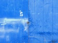Damaged blue metal sheet with lock, latch and hinge. Grunge Metal texture background. Architecture and construction pattern. Royalty Free Stock Photo